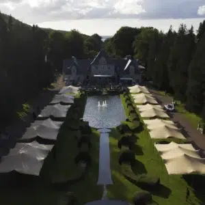 drone shots of Qtents stretch tent next to water at Aurora event sweden